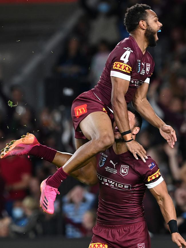 Hamiso Tabuai-Fidow of the Maroons celebrates with Valentine Holmes of the Maroons after scoring a try during game three of the 2021 State of Origin Series. (Photo by Bradley Kanaris/Getty Images)