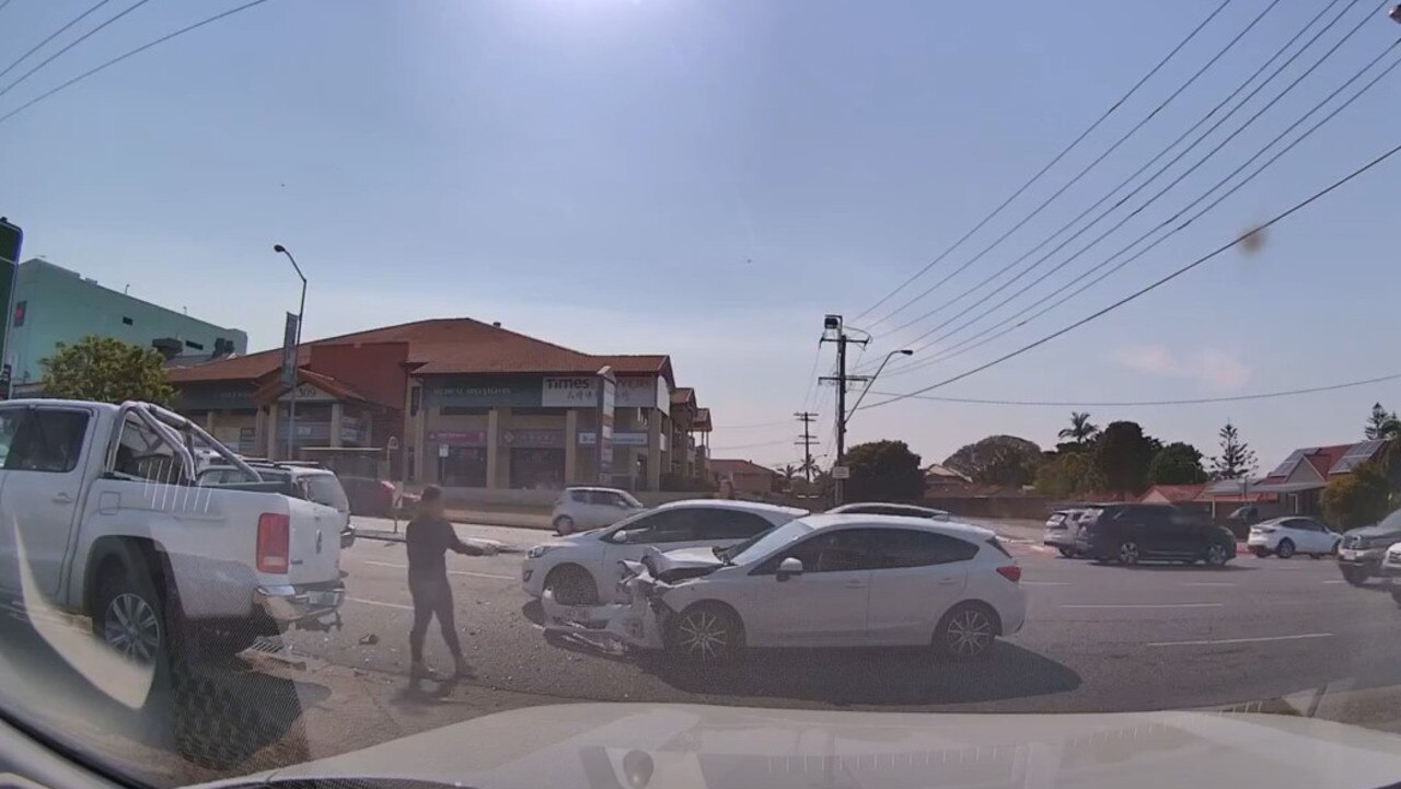 A white hatchback is hit by a ute as it tries to cross three lanes of traffic at Sunnybank.