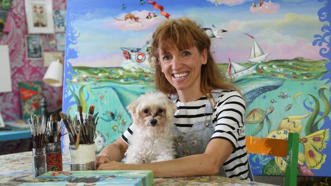 Cairns artist Hayley Gillespie in her studio with her dog Daffodil. PICTURE: STEWART MCLEAN