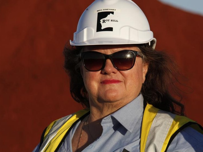 Billionaire Gina Rinehart, chairman of Hancock Prospecting Pty, stands for a photograph during a tour of the company's Roy Hill Mine operations under construction in the Pilbara region, Western Australia, on Thursday, Nov. 20, 2014. Rinehart, the Asia-Pacific's richest woman, is set to start exports in September from her new A$10 billion ($8.6 billion) iron ore mine undeterred by prices trading near five-year lows and forecast to extend losses. Photographer: Philip Gostelow/Bloomberg *** Local Caption *** Gina Rinehart