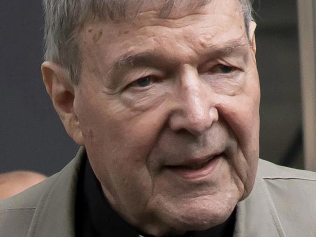 FILE - In this Feb. 26, 2019, file photo, Cardinal George Pell arrives at the County Court in Melbourne, Australia. A newspaper reports that Pell has been transferred from a Melbourne prison after a drone illegally flew overhead in a suspected attempt to photograph the famous inmate. (AP Photo/Andy Brownbill, File)