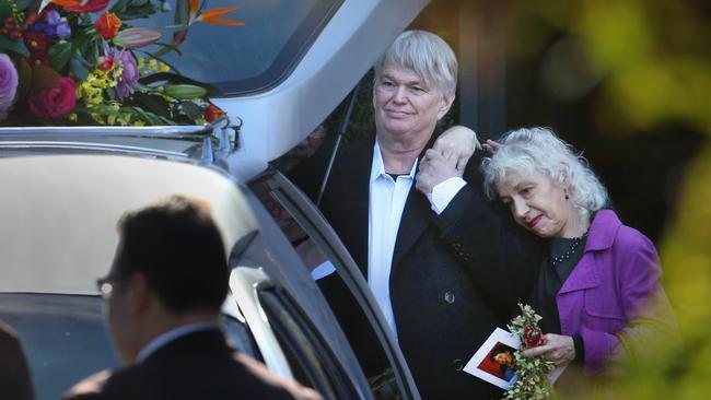 Eurydice Dixon’s father is comforted by a loved one behind his daughter’s hearse. Picture: David Caird