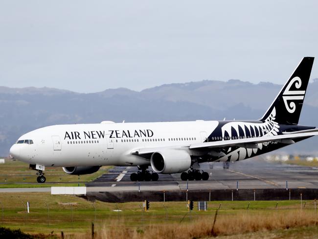 AUCKLAND, NEW ZEALAND - MARCH 16: An Air New Zealand plane is seen at Auckland Airport on March 16, 2020 in Auckland, New Zealand. Air New Zealand has announced it will reduce its international capacity by 85 per cent as a result of the current coronavirus pandemic and its impact on travel demand. The airline is suspending flights between Auckland and Chicago, San Francisco, Houston, Buenos Aires, Vancouver, Tokyo Narita, Honolulu, Denpasar and Taipei from 30 March to 30 June. It is also suspending its LondonLos Angeles service from 20 March through to 30 June. Air New Zealand's Tasman and Pacific Island network capacity will significantly reduce between April and June, while domestic route capacity will be reduced by around 30 percent in April and May. (Photo by Hannah Peters/Getty Images)