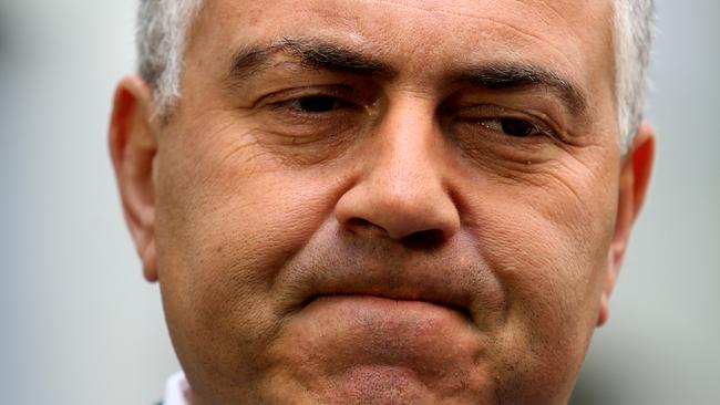 Not a happy man. Treasurer Joe Hockey is expected to reveal a further revenue hit in the next six months.