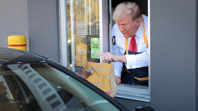 Donald Trump works the drive-through line as he visits a McDonald's restaurant on October 20 In Feasterville-Trevose, Pennsylvania.