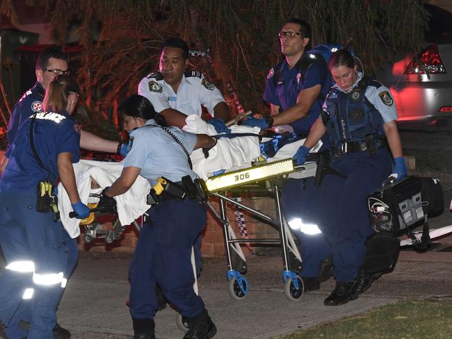 Ms Elahi is rushed to hospital after the alleged attack. Picture: Gordon McComiskie