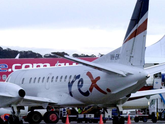 Aircraft (L-R) from regional airline Rex, Virgin and Qantas at terminal at Canberra Airport in Canberra.