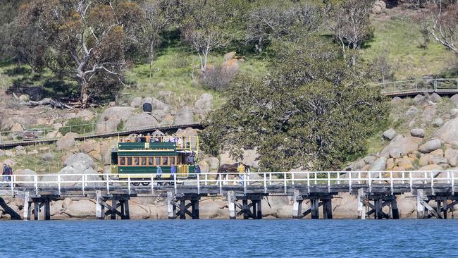 The horse-drawn tram crossing the causeway from Victor Harbor to Granite Island. Picture: Simon Cross