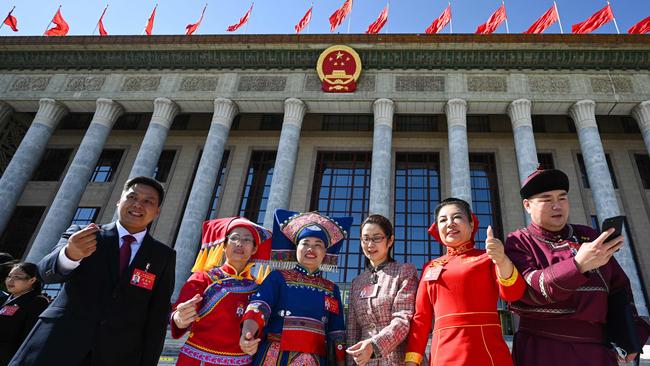 Delegates outside the Great Hall of the People on Sunday. Picture: AFP