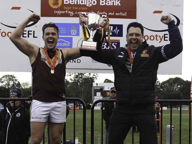 Lachlan McKernan and Matt Clark enjoy the spoils of last year’s premiership. Picture: Davis Harrigan