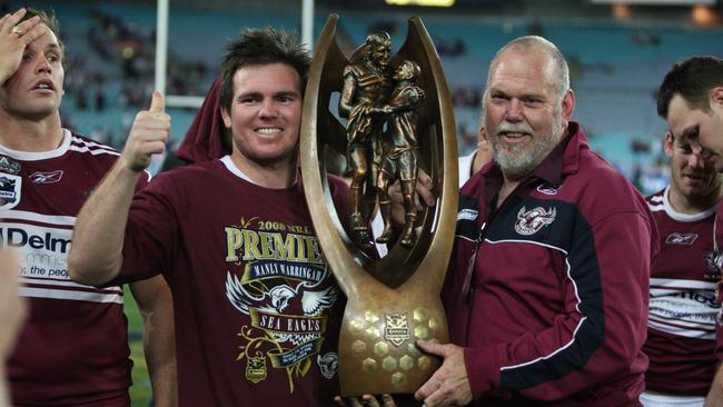 Number-1: Jamie Lyon hoisting the first of two trophies with the Sea Eagles.