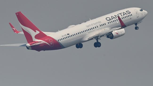 Qantas takes off from Sydney Airport. The airline will dramatically ramp up capacity into Victoria following the reopening of the border with New South Wales from November 23. Picture: Peter Parks/AFP