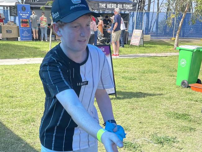 Kallum Jones plays cornhole at the Fraser Coast Flavours Festival at Seafront Oval on September 1, 2023.