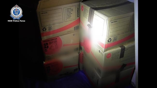 The illegal drugs were found in boxes in a locked garage beneath the unit. Picture: NSW Police