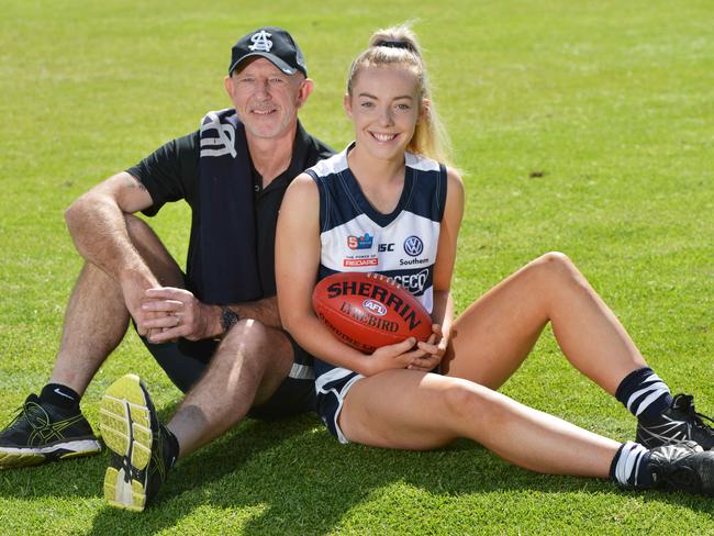 Former South Adelaide player Andrew Brockhurst and his daughter Emily, Saturday, March 9, 2019. South Adelaide had its first daughter of a past player make her debut in the SANFLW last week. (AAP Image/Brenton Edwards)