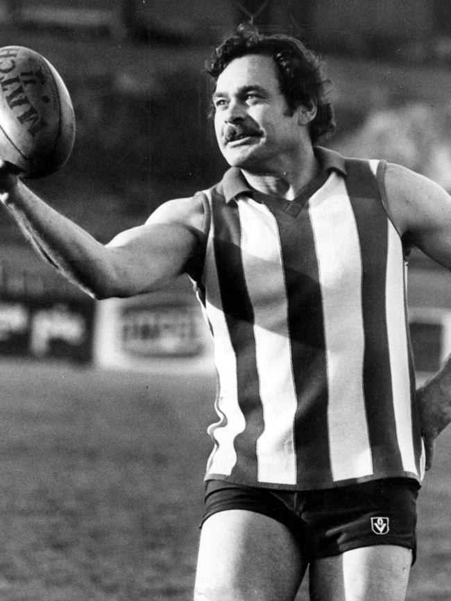 Then North Melbourne coach Ron Barassi has the ball on a string at training.