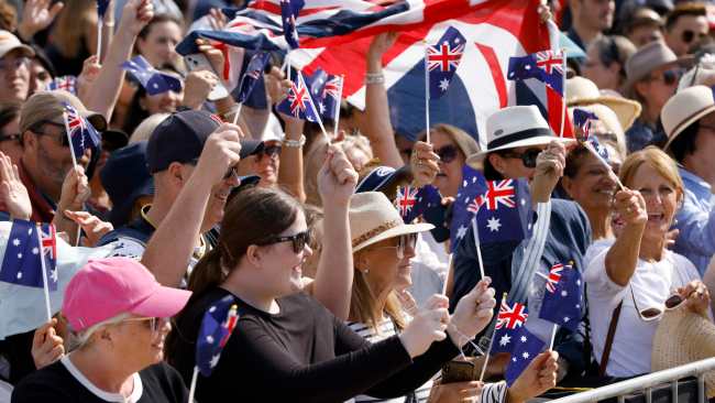 Aussie flags waved in the crowd in celebration of the King and Queen's tour Down Under. Picture: NewsWire / Damian Shaw