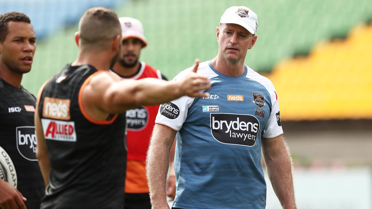 Moses Mbye and Robbie Farah with coach Michael Maguire during Wests Tigers training.