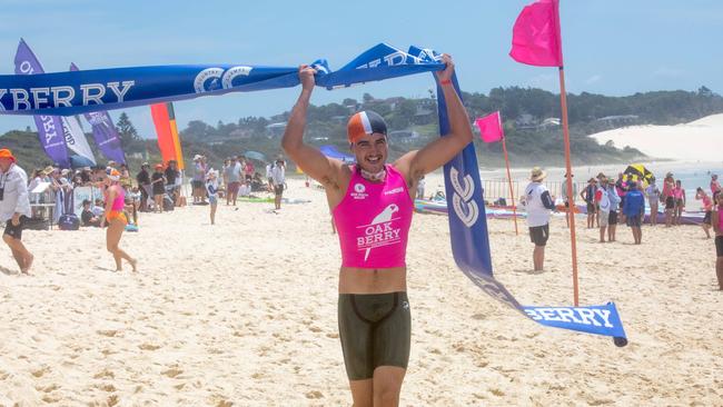 Warilla’s Bailey Krstevski crossing the finish line in first place in the open mixed Taplin relay. Photo: Shane Abrahamson/SLS NSW.