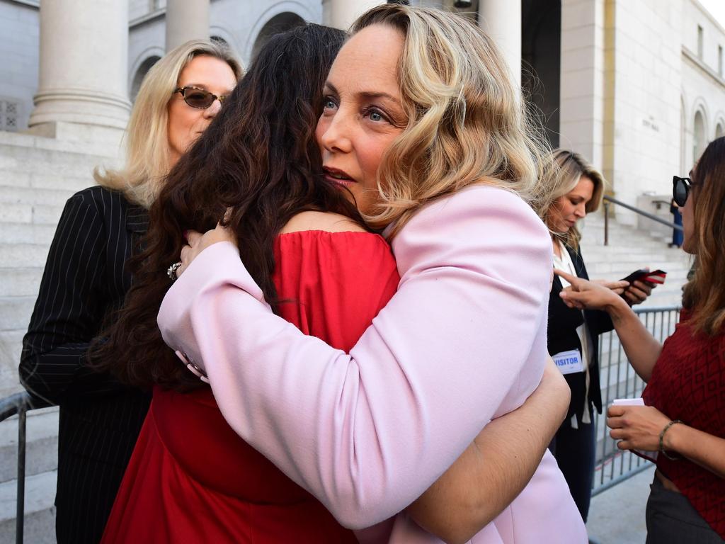 Lead plaintiff Louisette Geiss embraces Sarah Ann Masse outside the courtroom. Picture: Frederic J. Brown