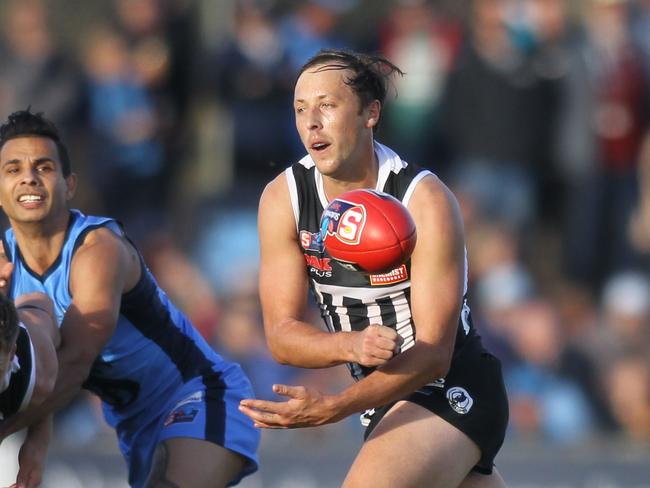 SANFL: Port Adelaide v Sturt at Alberton Oval. 8 June 2019. Port's Cameron Sutcliffe handballs.(AAP Image/Dean Martin)