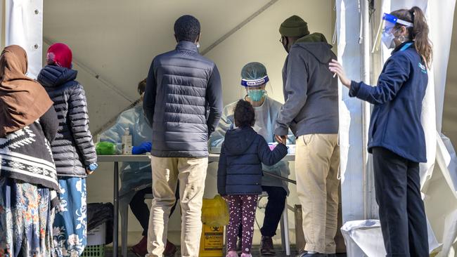 Residents queue for Covid testing outside 130 Racecourse Rd, Flemington. Picture: NCA NewsWire