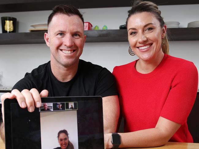 Flow Athletic gym owner Ben Lucas and his wife Talitha Cummins pictured at home using Zoom to have a meetings with staff and clients due to the COVID-19 virus pandemic. Picture: David Swift