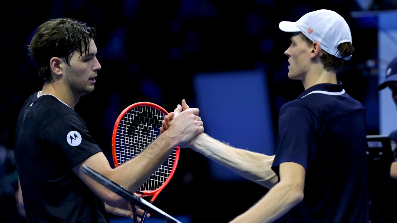 TURIN, ITALY - NOVEMBER 12: Taylor Fritz of United States and Jannik Sinner of Italy embrace following the Men's Singles Ilie Nastase Group Stage match during day three of the Nitto ATP finals 2024 at Inalpi Arena on November 12, 2024 in Turin, Italy. (Photo by Clive Brunskill/Getty Images)