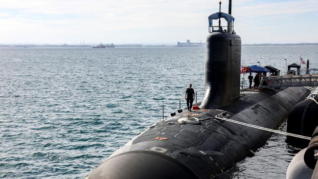 US Navy officers stand guard aboard Virginia-class fast attack submarine USS Minnesota. Picture: Colin Murty - Pool/Getty Images