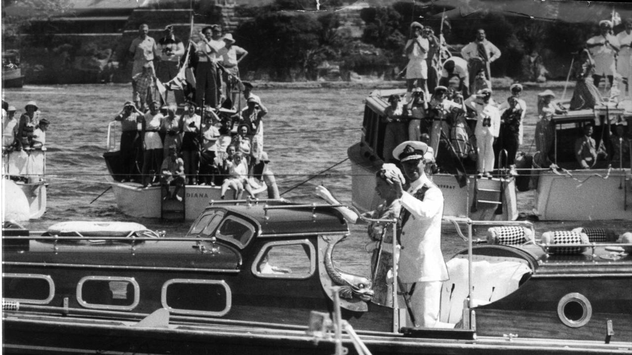 FEBRUARY 1954 : The royal barge passes through a laneway of yachts during the tour by Queen Elizabeth and her husband Prince Philip, the Duke of Edinburgh, in Sydney, 02/54. Picture:News Ltd. Royals Australia's First Century Historical