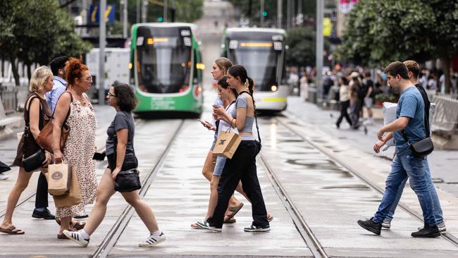 MELBOURNE, AUSTRALIA - NCA NewsWire Photos - 13 DECEMBER, 2023: People carry shopping bags while walking along Bourke Street Mall in Melbourne. Picture: NCA NewsWire / Diego Fedele