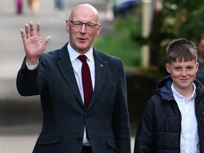 First Minister of Scotland John Swinney and his son Matthew walk to a polling station in Blairgowrie. Picture: Getty