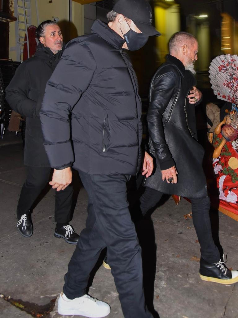 Leo covered up as he left the dinner date. Picture: Roka/Backgrid