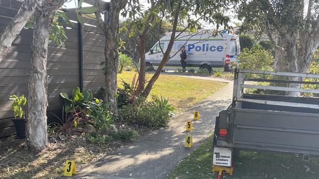 Police markers beside blood spots on the corner of Saltwater Cres and Matthews Parade, Corindi Beach. Picture: Chris Knight