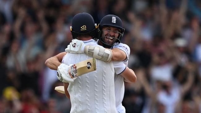 Mark Wood, right, celebrates with Chris Woakes after the latter hit a boundary to win the Headingley Test match on day four. Picture: AFP