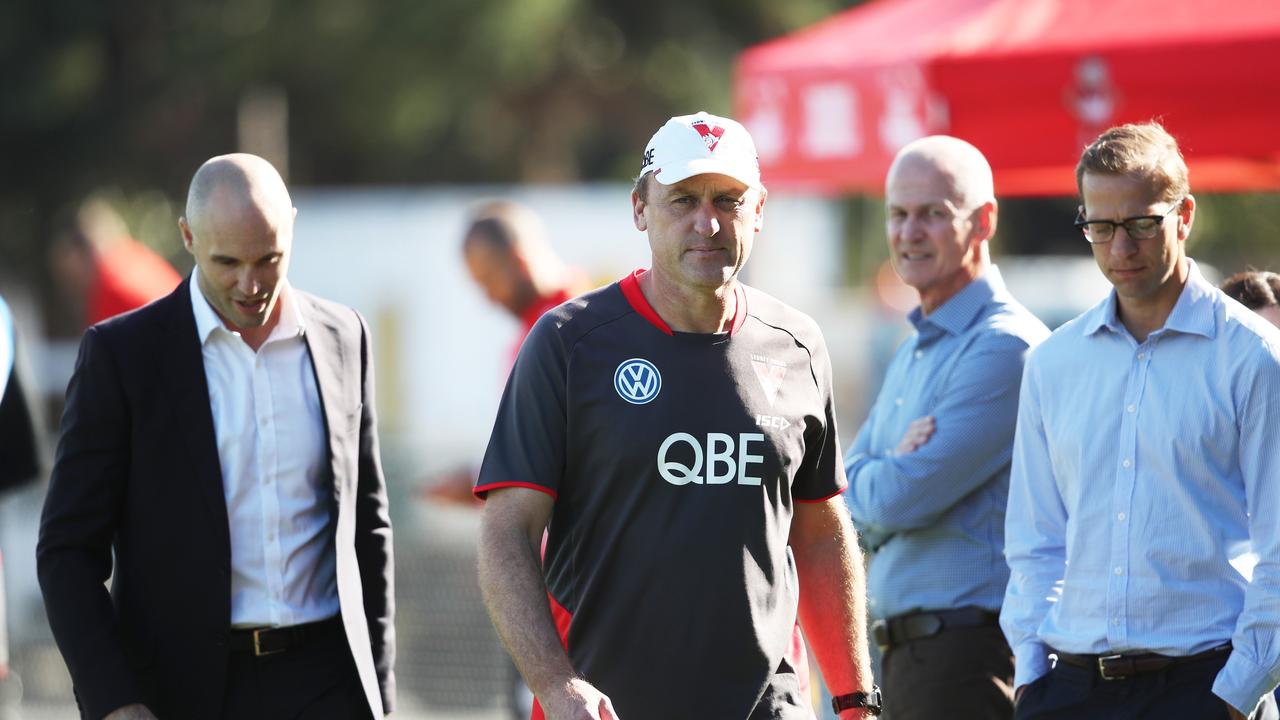 John Longmire with Tom Harley and football manager Charlie Gardiner in 2019.