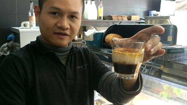 Snow Velvet Cafe owner Marky Duong with Vietnamese egg coffee, a signature drink from Hanoi.