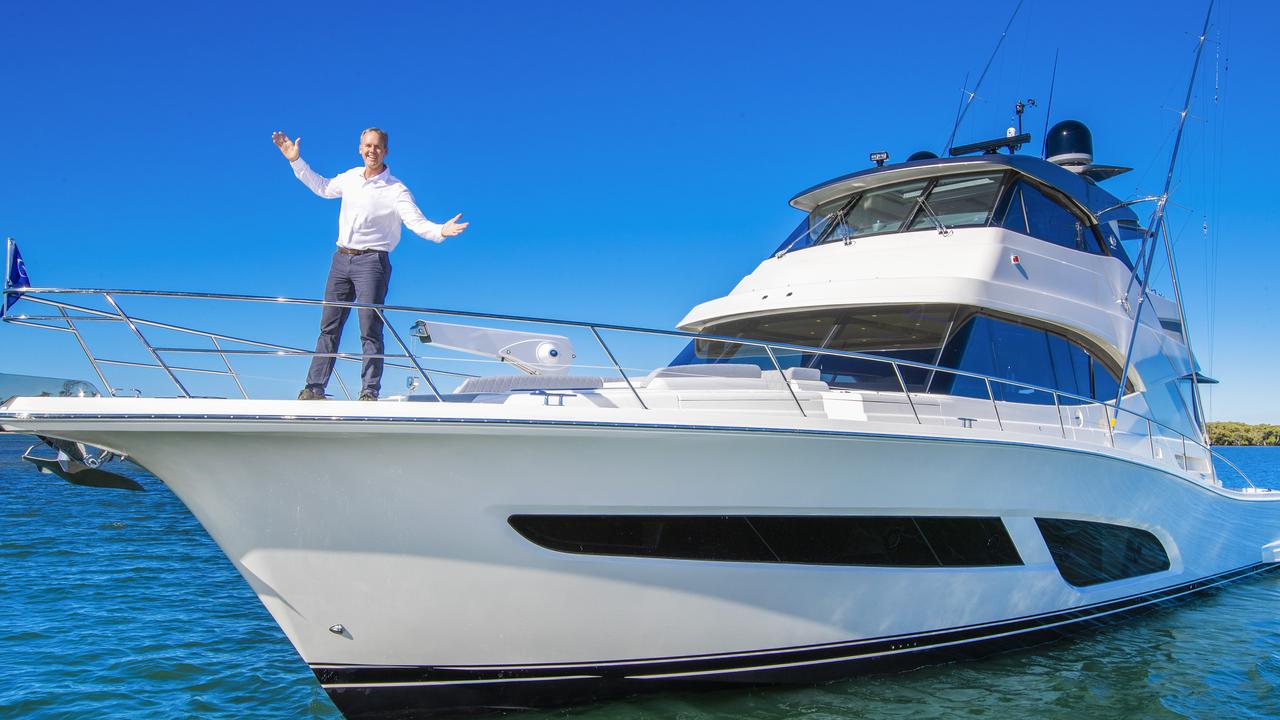 Riviera boss Rodney Longhurst with the company's new $3.2 million 64 Sports Motor Yacht. Picture: Nigel Hallett