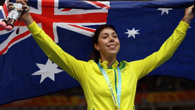 Gold medallist Australia's Georgia Baker celebrates on the podium during the medal presentation ceremony for the women's 25km points race cycling event on day three of the Commonwealth Games, at the Lee Valley VeloPark in east London, on July 31, 2022. (Photo by ADRIAN DENNIS / AFP)