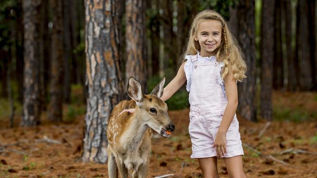 Tiah Bouveng holding Prince from Mr Little Farm Friends. Picture: Jerad Williams