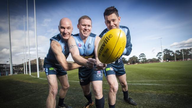 Lindisfarne Football Club Masters players (L-R) Mathew Bedford, James Hodge (coach) and Sean McGuire keen to be back into the footy this Friday evening under lights. Picture: LUKE BOWDEN