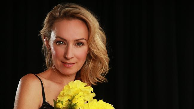 Pic of actress Lisa McCune with flowers for a promo for garden show in Melbourne.