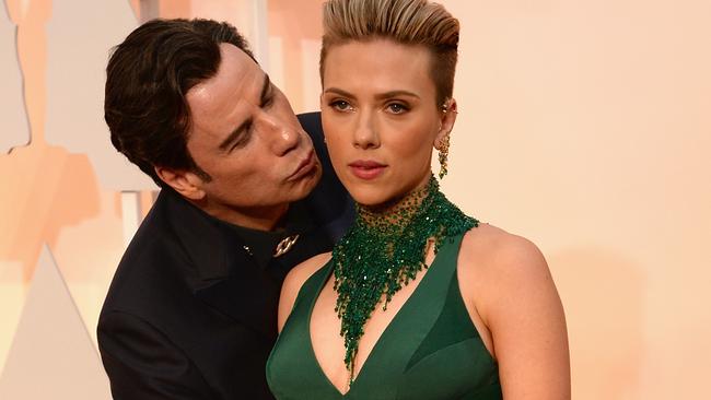 HOLLYWOOD, CA - FEBRUARY 22: Actor John Travolta (L) and actress Scarlett Johansson attend the 87th Annual Academy Awards at Hollywood & Highland Center on February 22, 2015 in Hollywood, California. (Photo by Kevin Mazur/WireImage)