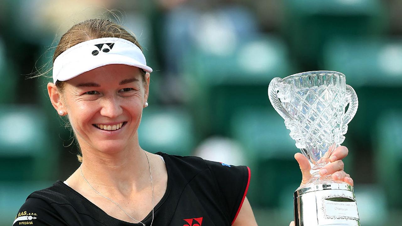 (FILES) In this file photo taken on October 12, 2014 the Czech Republic's Renata Voracova poses with her trophy after winning the women's doubles final at the Japan Women's Open tennis tournament in Osaka, western Japan. - Czech tennis player Renata Voracova has ended up in the same detention as Serbian star Novak Djokovic in the run-up to the Australian Open, the Czech foreign ministry said on January 7, 2022. "Renata Voracova is in the same detention as Djokovic, together with several other tennis players, that is, in Melbourne," the ministry told AFP in an e-mail. (Photo by JIJI PRESS / AFP)