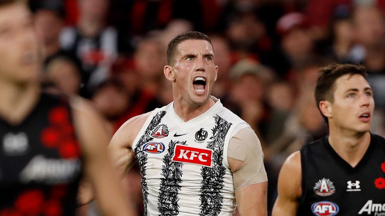 Darcy Cameron celebrates a goal as the Pies proved too good for Essendon.