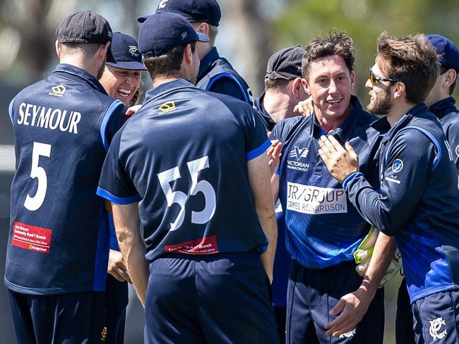 The Prahran players get around wicket-taker Andrew Perrin. Pic: Arj Giese