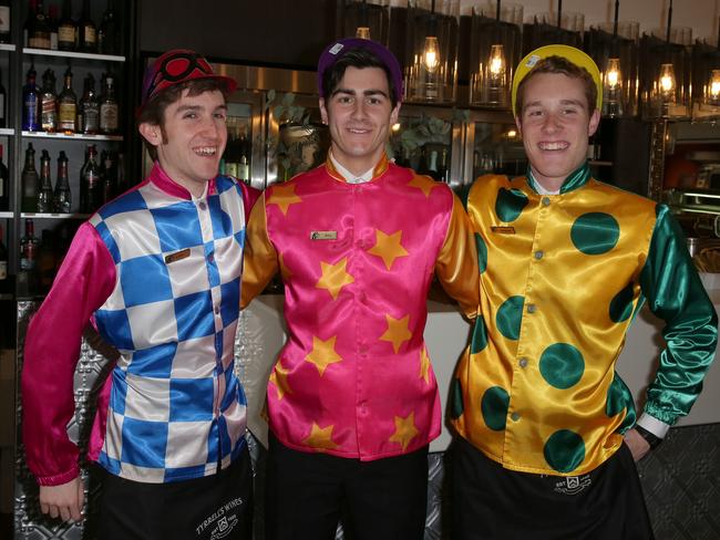 Luke Marziano, Alex Johnson and Stephen Hunt horsing around at the Melbourne Cup luncheon at The Epping Club last year. Photo: Adam Ward