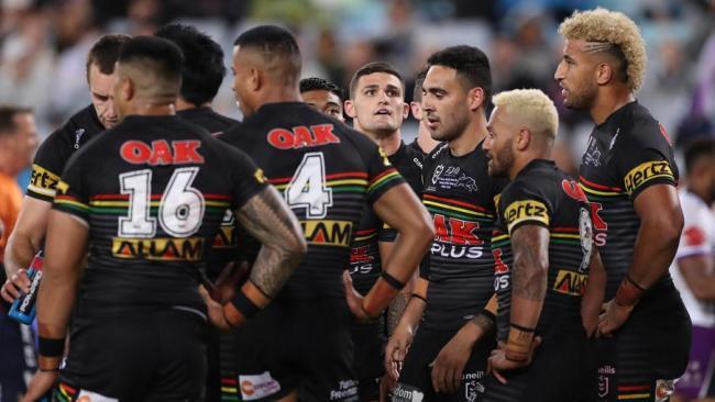 Dejected Panthers players react after a Storm try.