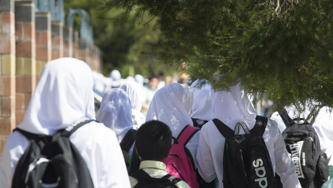 NO BYLINE - General photographs of students leaving Malek Fahd Islamic School on Waterloo Road in Greenacre NSW Australia - Government is discussing whether to remove funding from the school or not after funds have been misused.