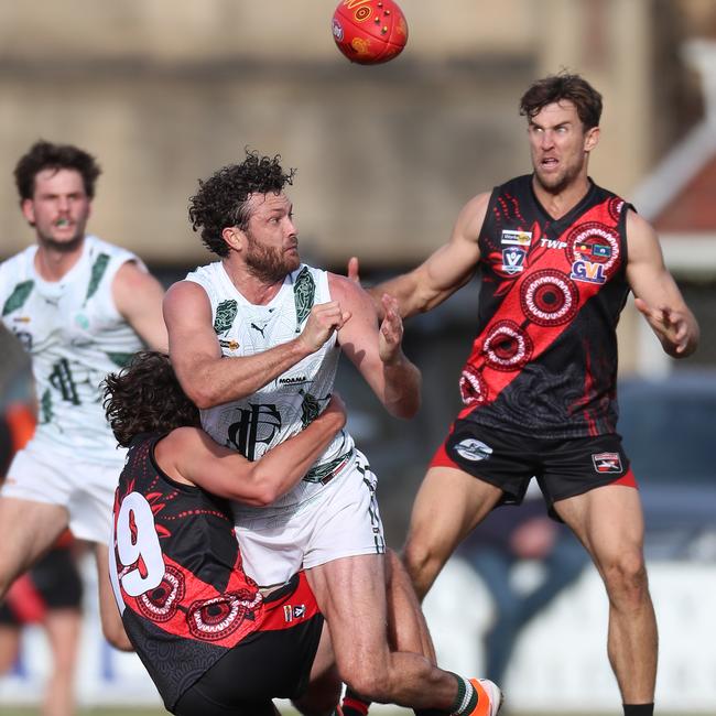 Echuca’s Sam Reid is tackled by Kyabram’s Charlie Barnett.